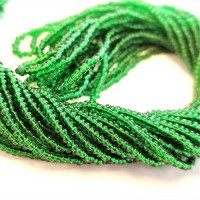11/0 Medium Green Transparent Charlottes, approx. 22g
