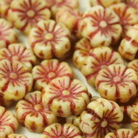 Pressed glass flower head shaped beads in a range of sizes